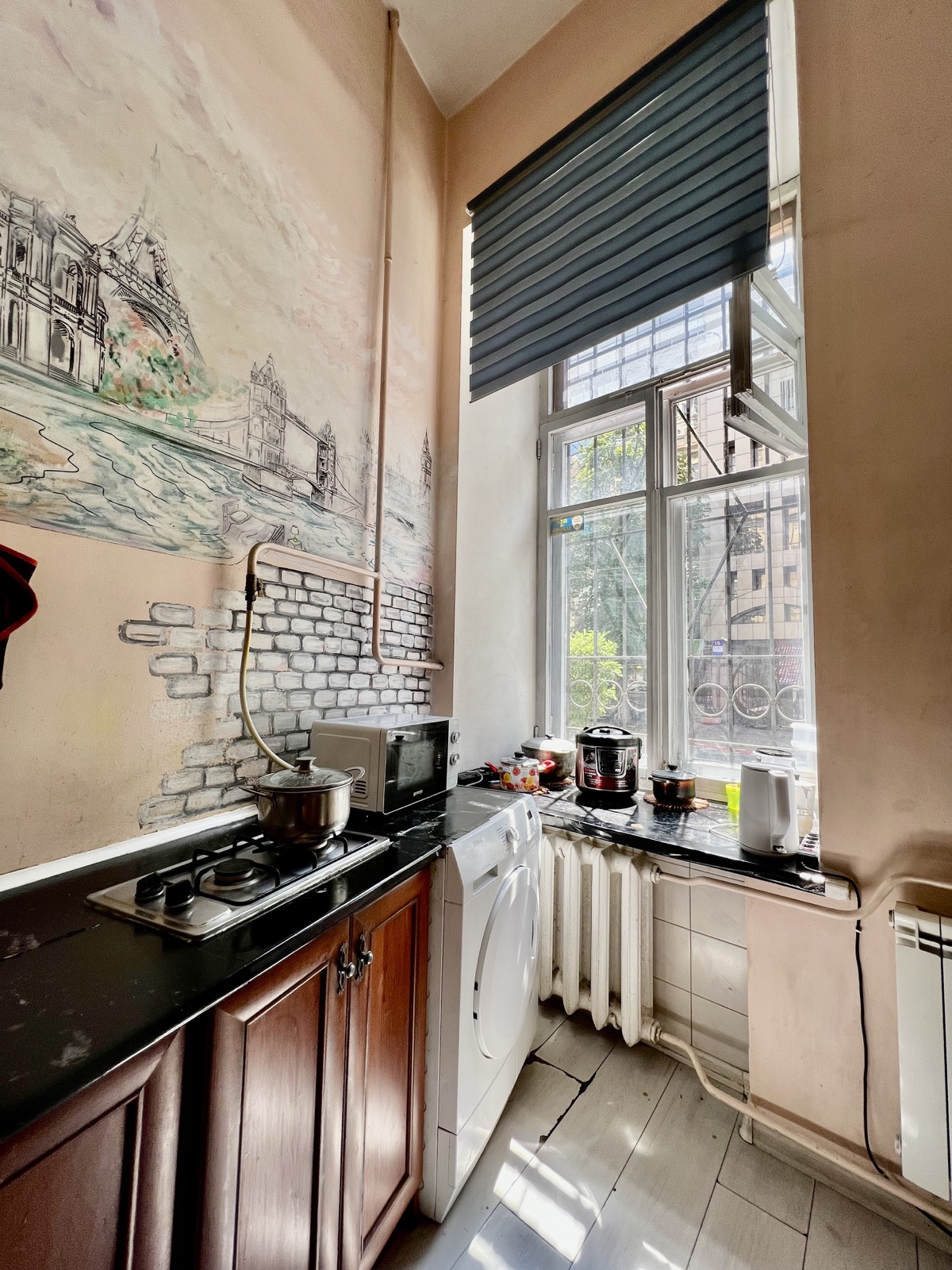 Dja Hostel kitchen — stove and window