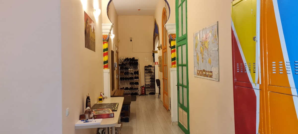 Dja Hostel corridor — lockers and map